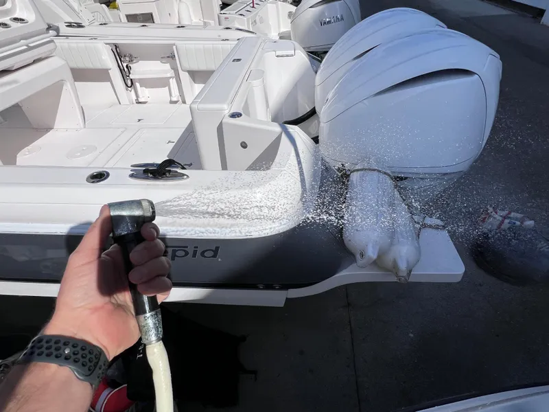 Slide: The Image of Washing a 2016 Pursuit DC 295 boat with twin Yamaha 300 engines. - 36