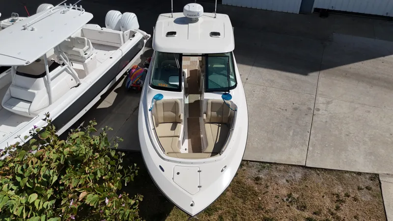 Slide: The Image of 2016 Pursuit DC 295 Dual Console boat with twin Yamaha 300 engines, aerial view. - 4
