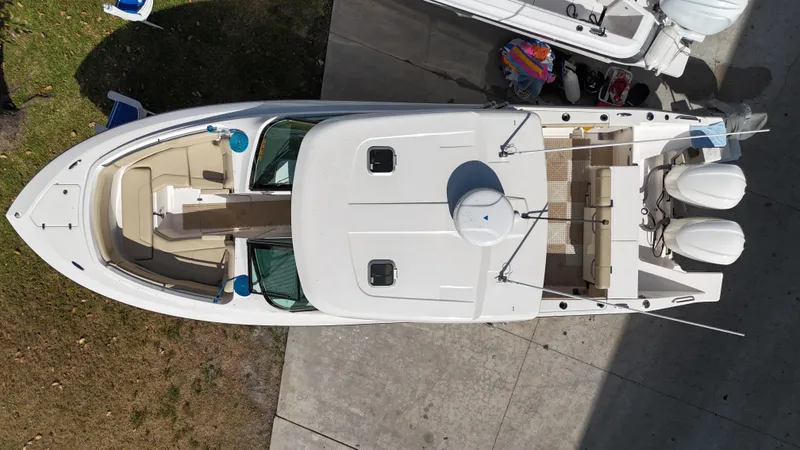 Slide: The Image of 2016 Pursuit DC 295 Dual Console boat with twin Yamaha 300 engines, aerial view. - 6