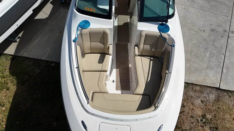 Slide: The Image of 2016 Pursuit DC 295 Dual Console boat with spacious seating and clean design. - 8