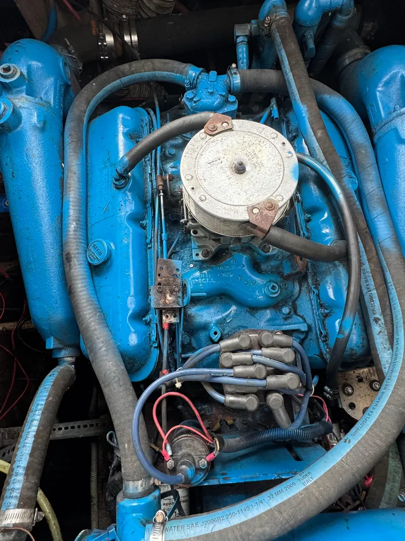 Slide: The Image of 1987 Silverton Express engine, painted blue, with visible hoses and wiring. - 13