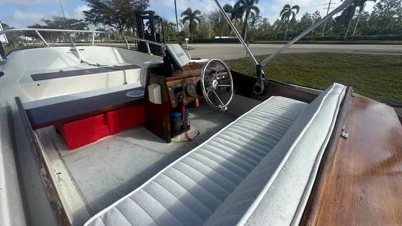 Slide: The Image of 1971 Boston Whaler 13 Sport interior with white seating and wooden dashboard. - 5