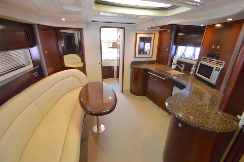 Slide: The Image of Luxurious interior of 2007 Sea Ray 44 Sundancer yacht with modern kitchen and seating area. - 1