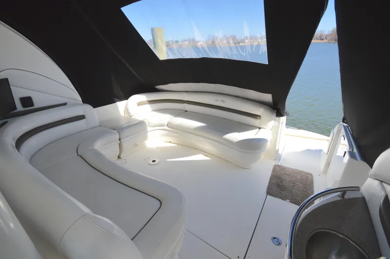 Slide: The Image of Luxurious interior of 2007 Sea Ray 44 Sundancer yacht with white seating and water view. - 13