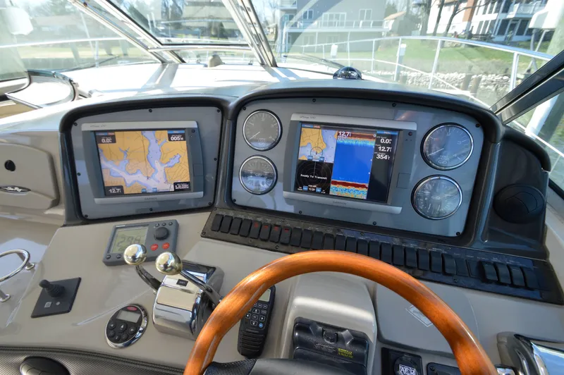 Slide: The Image of 2007 Sea Ray 44 Sundancer helm with navigation screens and controls. - 2