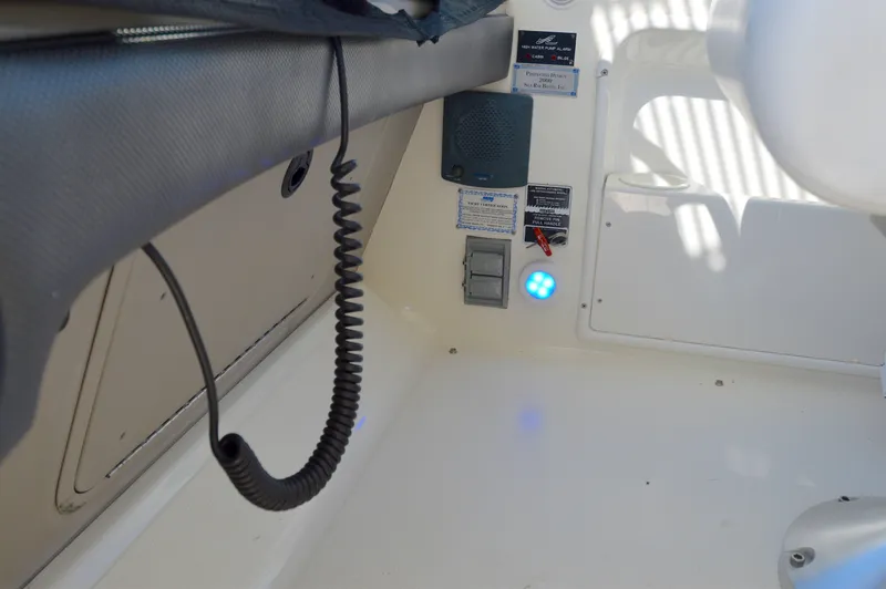 Slide: The Image of 2007 Sea Ray 44 Sundancer interior with control panel and coiled cable. - 26