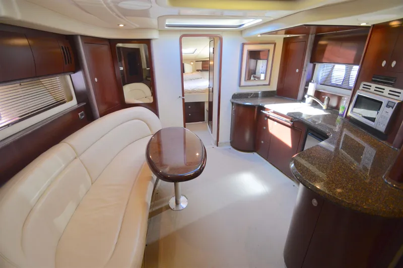 Slide: The Image of Luxurious interior of 2007 Sea Ray 44 Sundancer yacht with modern kitchen and seating area. - 29