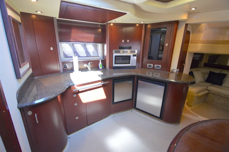 Slide: The Image of Luxurious kitchen interior of 2007 Sea Ray 44 Sundancer yacht with modern appliances. - 32