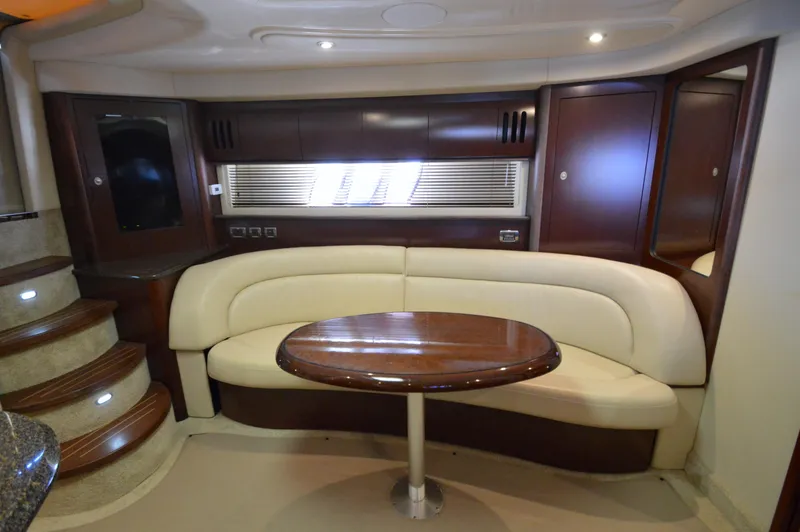 Slide: The Image of Luxurious 2007 Sea Ray 44 Sundancer yacht interior with elegant seating and wooden table. - 39