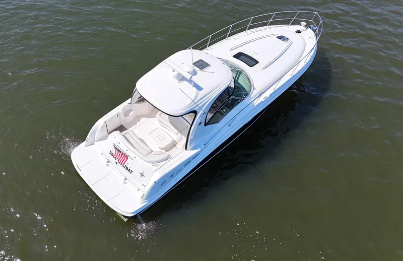 Slide: The Image of 2007 Sea Ray 44 Sundancer yacht cruising on open water, aerial view. - 4