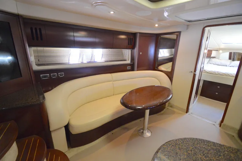 Slide: The Image of Luxurious interior of 2007 Sea Ray 44 Sundancer yacht with elegant seating and table. - 42