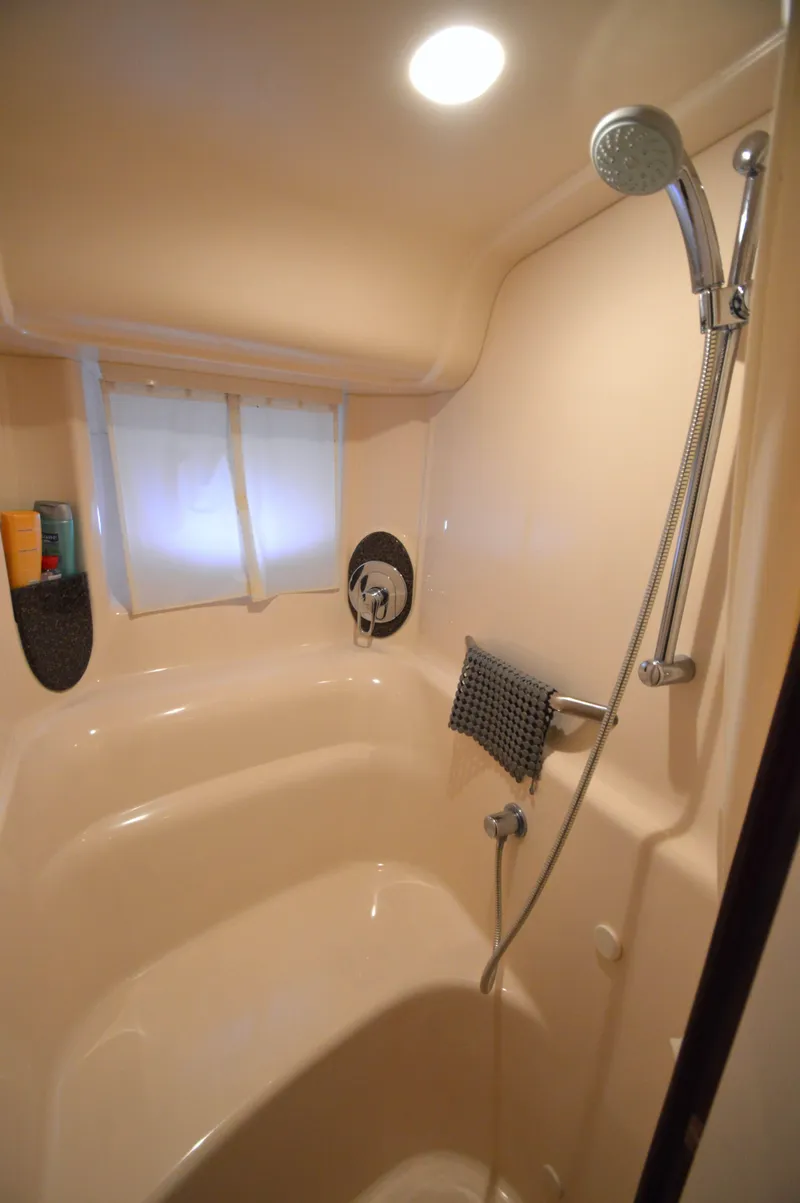 Slide: The Image of Shower area in 2007 Sea Ray 44 Sundancer yacht with modern fixtures and lighting. - 46