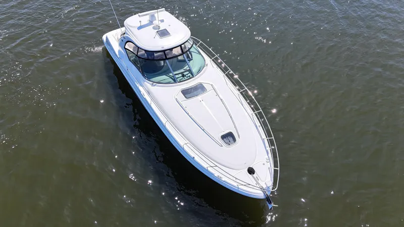 Slide: The Image of 2007 Sea Ray 44 Sundancer yacht cruising on open water, aerial view. - 5