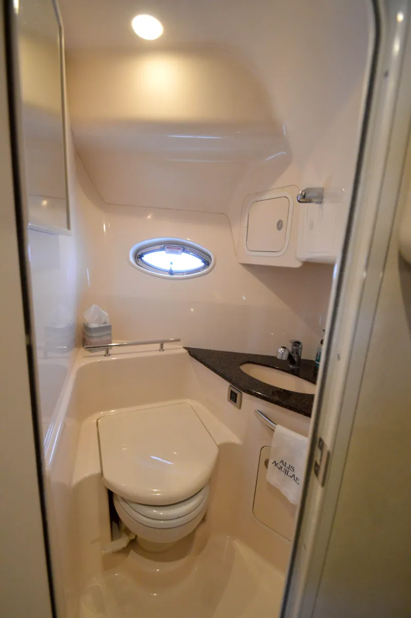 Slide: The Image of 2007 Sea Ray 44 Sundancer yacht bathroom with compact design and modern amenities. - 52