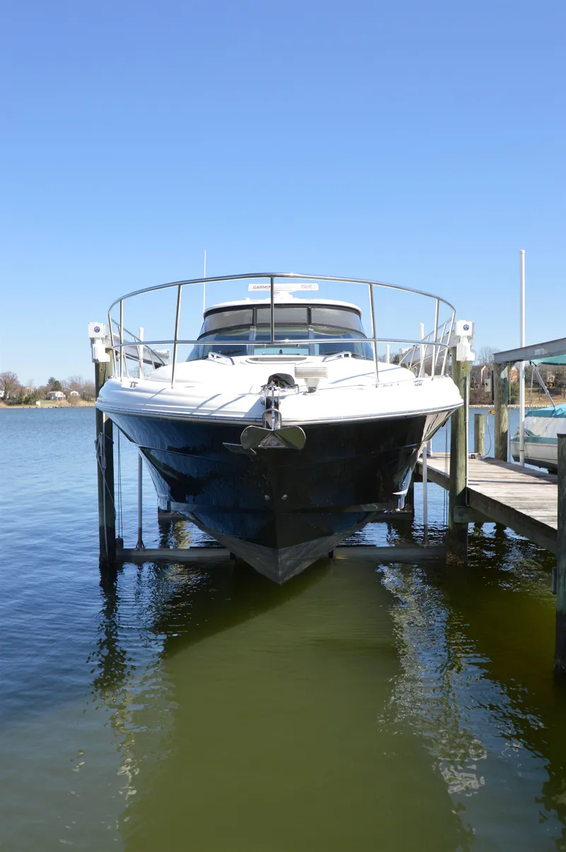 Slide: The Image of 2007 Sea Ray 44 Sundancer yacht docked on a lift, front view. - 9
