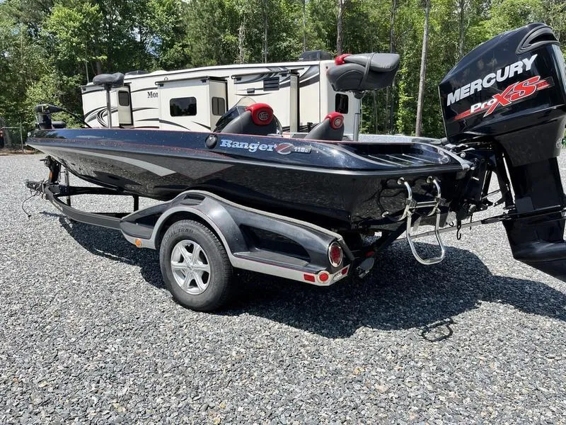 Slide: The Image of 2014 Ranger Z118 Comanche boat with Mercury Pro XS engine on a trailer. - 2