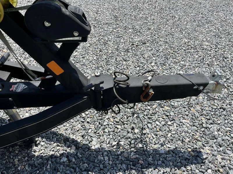 Slide: The Image of Trailer hitch of 2014 Ranger Z118 Comanche on gravel surface. - 5