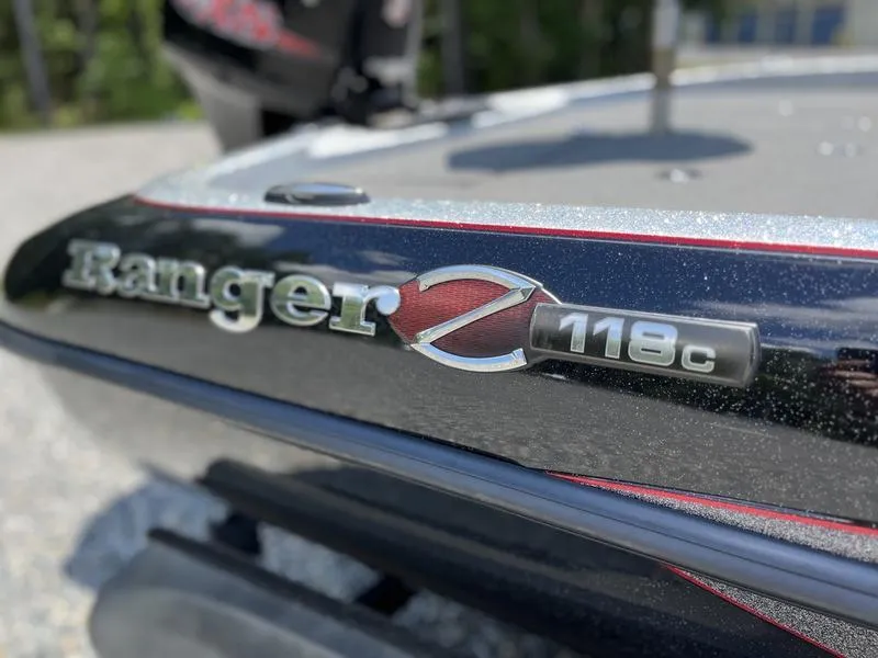 Slide: The Image of 2014 Ranger Z118 Comanche boat emblem close-up with metallic finish. - 6