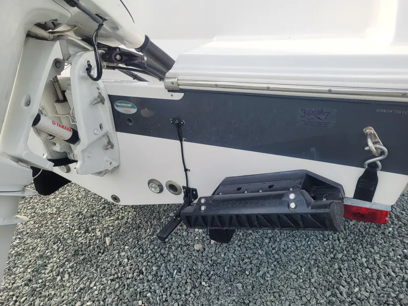 Slide: The Image of 2023 Sportsman Open 232 Center Console boat stern with motor mount and step ladder. - 9