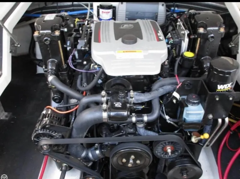 Slide: The Image of Engine of a 2012 Crownline E1EC1Z boat, showcasing detailed components and layout. - 10
