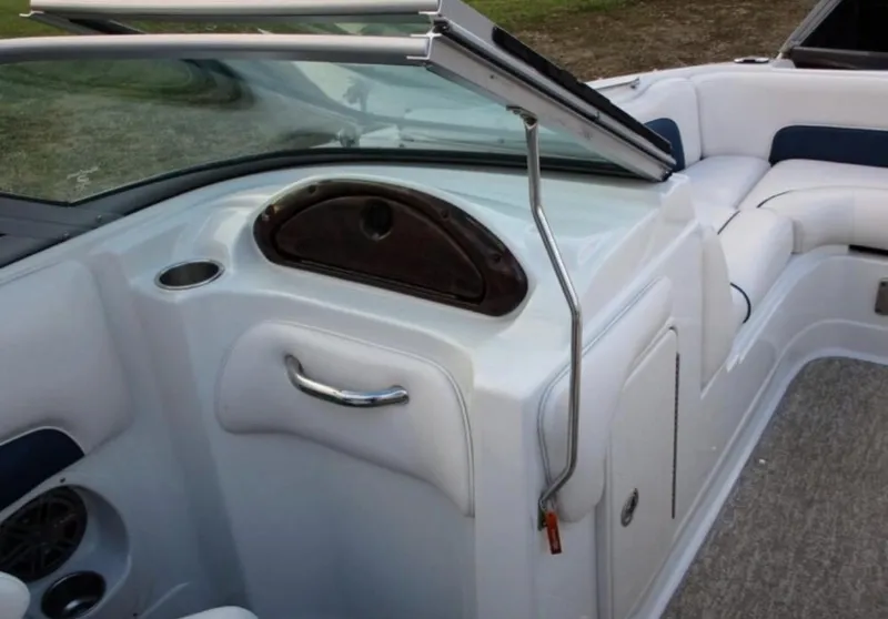 Slide: The Image of 2012 Crownline E1EC1Z boat interior with white seating and windshield. - 12