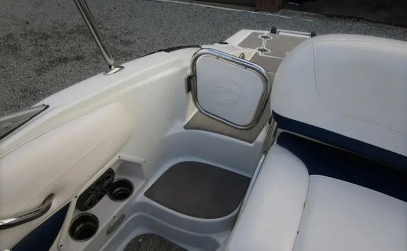 Slide: The Image of Interior of 2012 Crownline E1EC1Z boat with white seating and cup holders. - 7