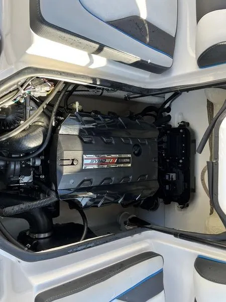 Slide: The Image of 2021 Yamaha AR195 engine compartment showcasing powerful marine engine components. - 10