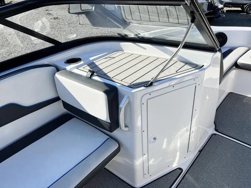 Slide: The Image of 2021 Yamaha Boats AR195 interior with seating and storage, featuring sleek design and modern finishes. - 15