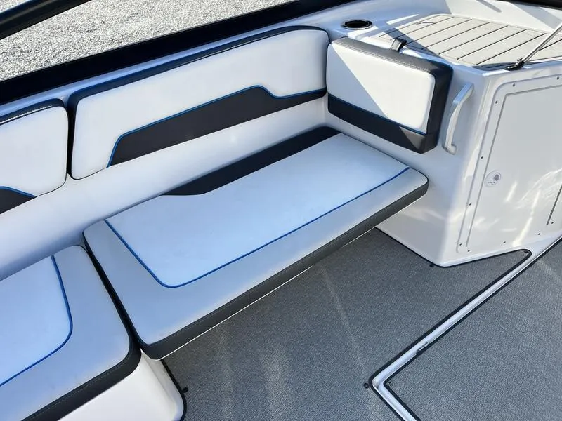 Slide: The Image of 2021 Yamaha AR195 boat interior with white and black seating, modern design. - 16
