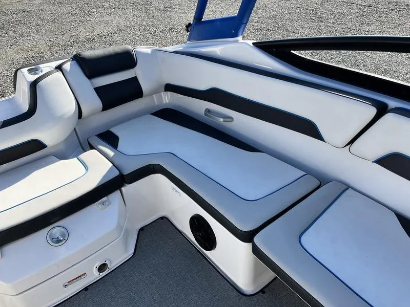 Slide: The Image of 2021 Yamaha Boats AR195 interior seating with sleek black and white design. - 17