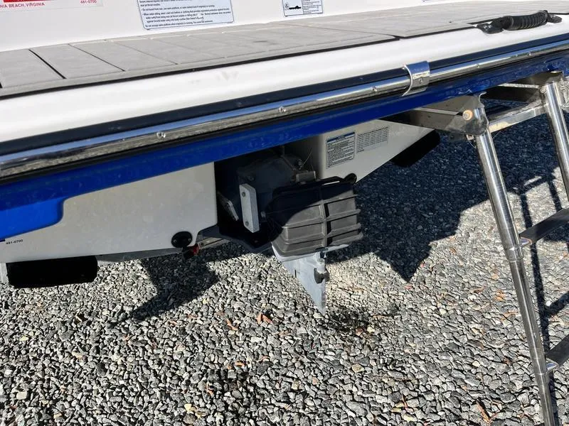 Slide: The Image of 2021 Yamaha AR195 boat stern with ladder and jet drive on gravel surface. - 9