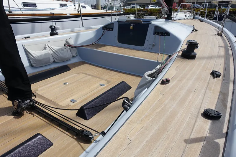Slide: The Image of Maxi Dolphin CrossCurrent 33 sailboat deck, 2006 model, featuring sleek wooden finish and modern fittings. - 12