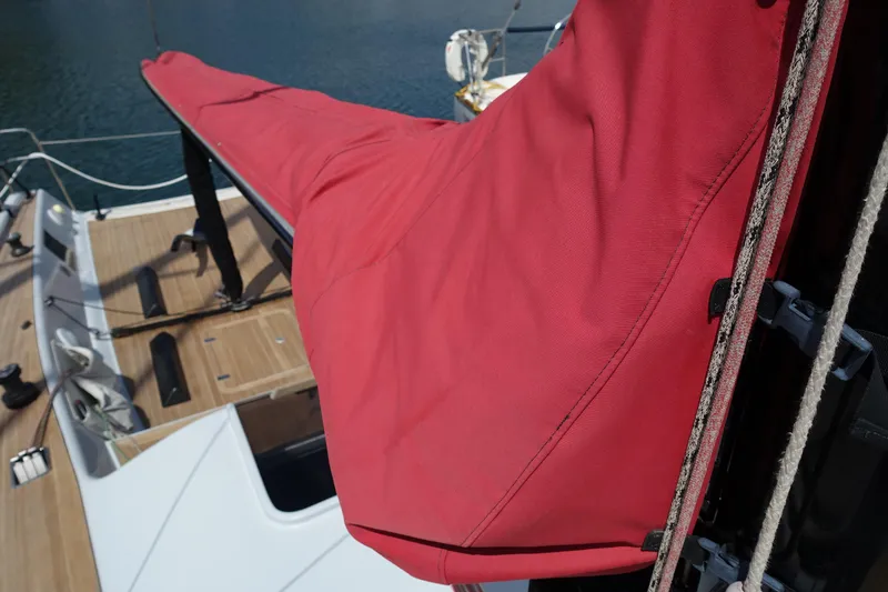 Slide: The Image of Red sail cover on 2006 Maxi Dolphin CrossCurrent 33 yacht deck. - 18