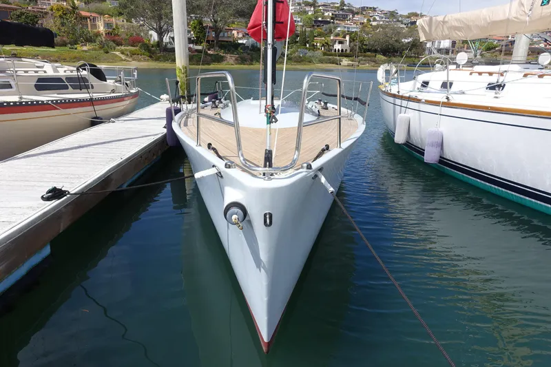 Slide: The Image of 2006 Maxi Dolphin CrossCurrent 33 yacht docked at marina, front view. - 2