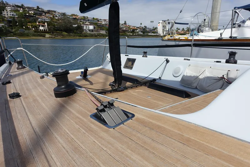 Slide: The Image of Sailboat deck of 2006 Maxi Dolphin CrossCurrent 33, featuring sleek design and wooden finish. - 8