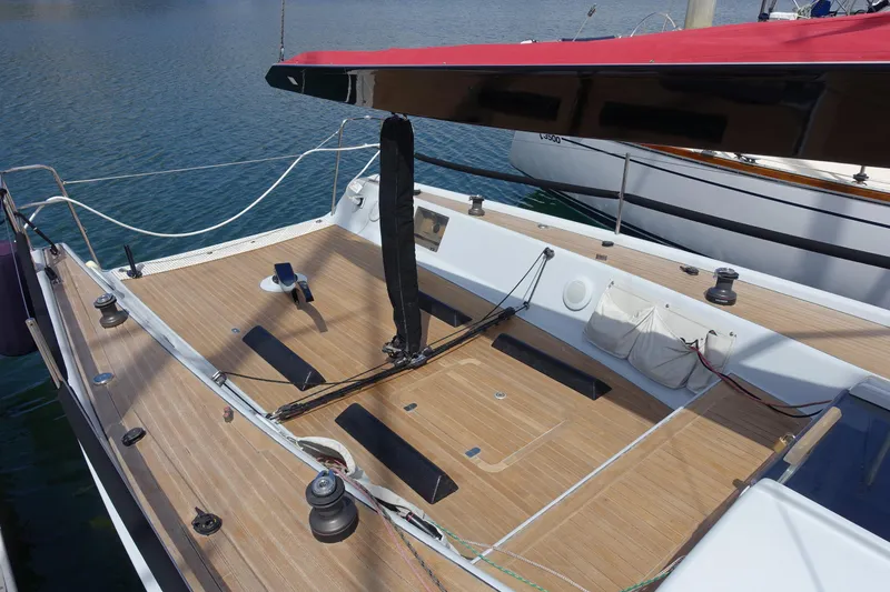 Slide: The Image of 2006 Maxi Dolphin CrossCurrent 33 sailboat with teak deck, docked in a marina. - 9