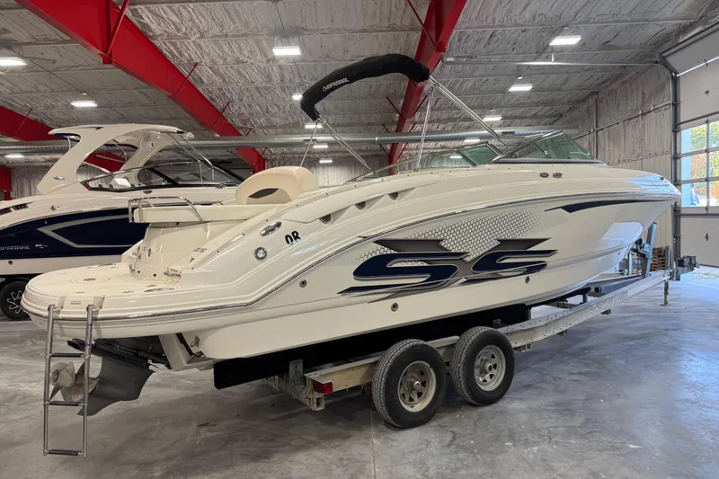 Slide: The Image of 2007 Chaparral 276 SSi boat on trailer in indoor storage facility. - 19