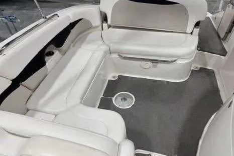 Slide: The Image of 2007 Chaparral 276 SSi boat interior with white seating and gray flooring. - 25
