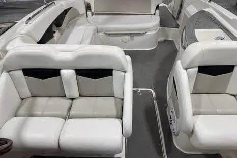 Slide: The Image of 2007 Chaparral 276 SSi boat interior with white and beige seating arrangement. - 26