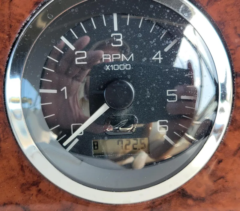 Slide: The Image of Tachometer of 2000 Sea Ray 380 Aft Cabin showing 725 RPM. - 13