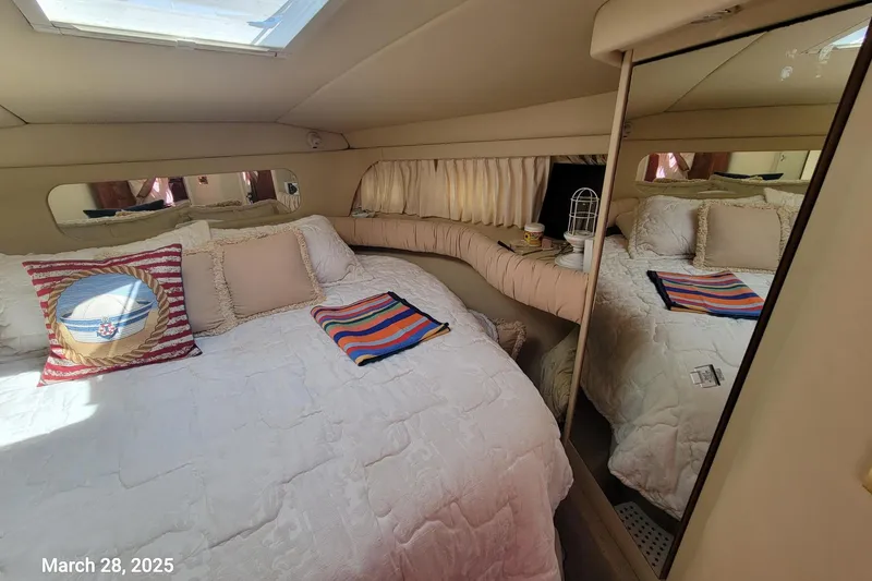 Slide: The Image of Cozy bedroom in 2000 Sea Ray 380 Aft Cabin yacht with mirrored closet and skylight. - 36