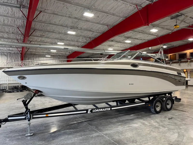 Slide: The Image of 2003 Crownline 280 BR boat on Loadmaster trailer in indoor storage. - 3