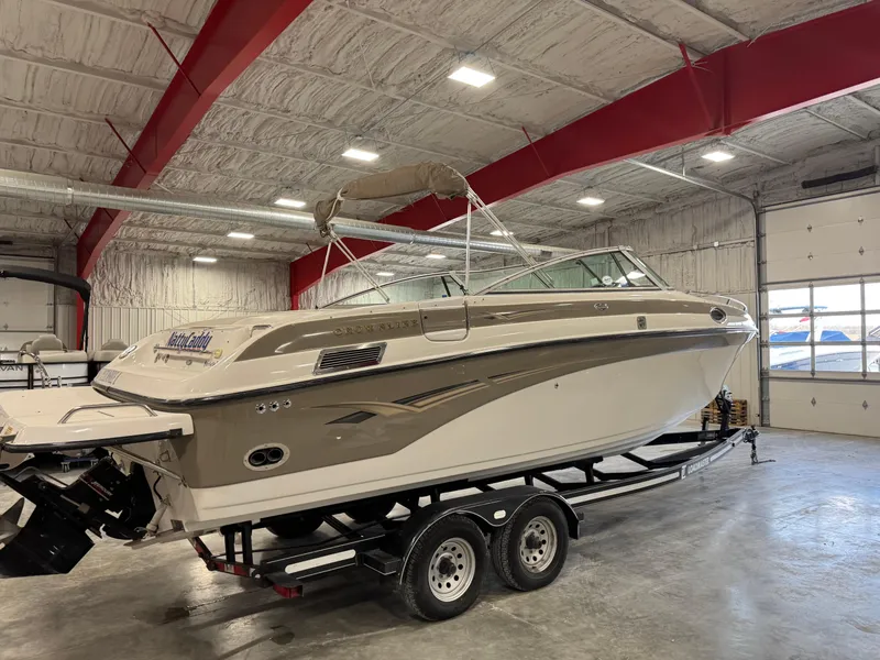 Slide: The Image of 2003 Crownline 280 BR boat on trailer in indoor storage facility. - 4