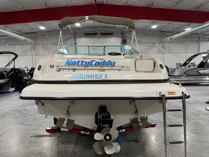 Slide: The Image of 2003 Crownline 280 BR boat in indoor storage, featuring "NattyCaddy" and "Collinsville, IL" text. - 5