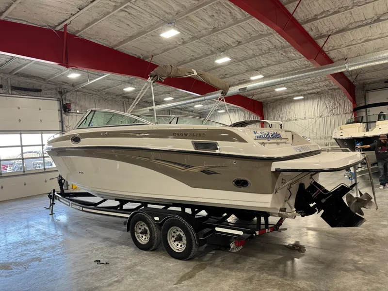 Slide: The Image of 2003 Crownline 280 BR boat on trailer in indoor storage facility. - 6