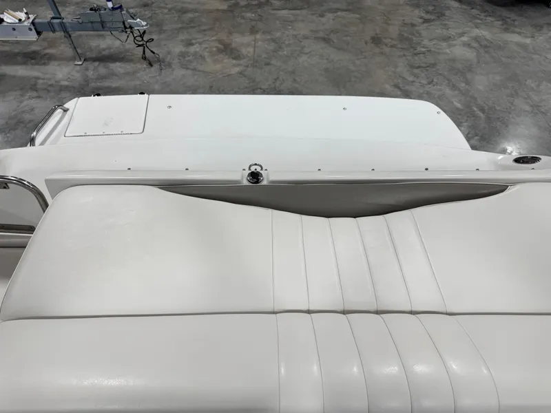 Slide: The Image of 2003 Crownline 280 BR boat interior with white leather seating and sleek design. - 8