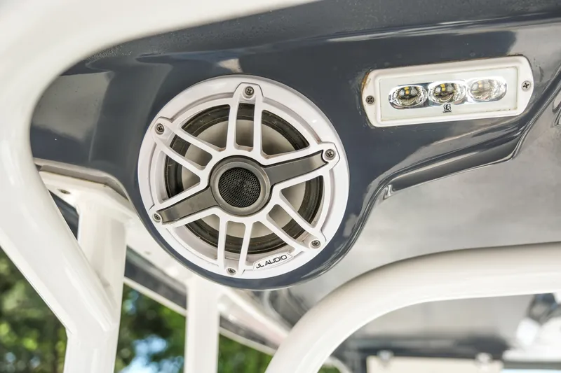 Slide: The Image of 2022 Robalo R247 Dual Console boat speaker and light detail. - 22