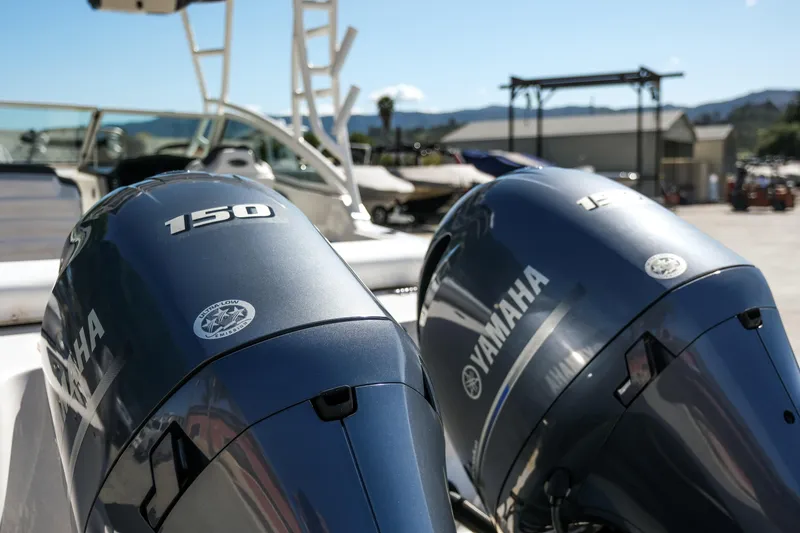 Slide: The Image of Twin Yamaha outboard engines on a 2022 Robalo R247 Dual Console boat. - 24