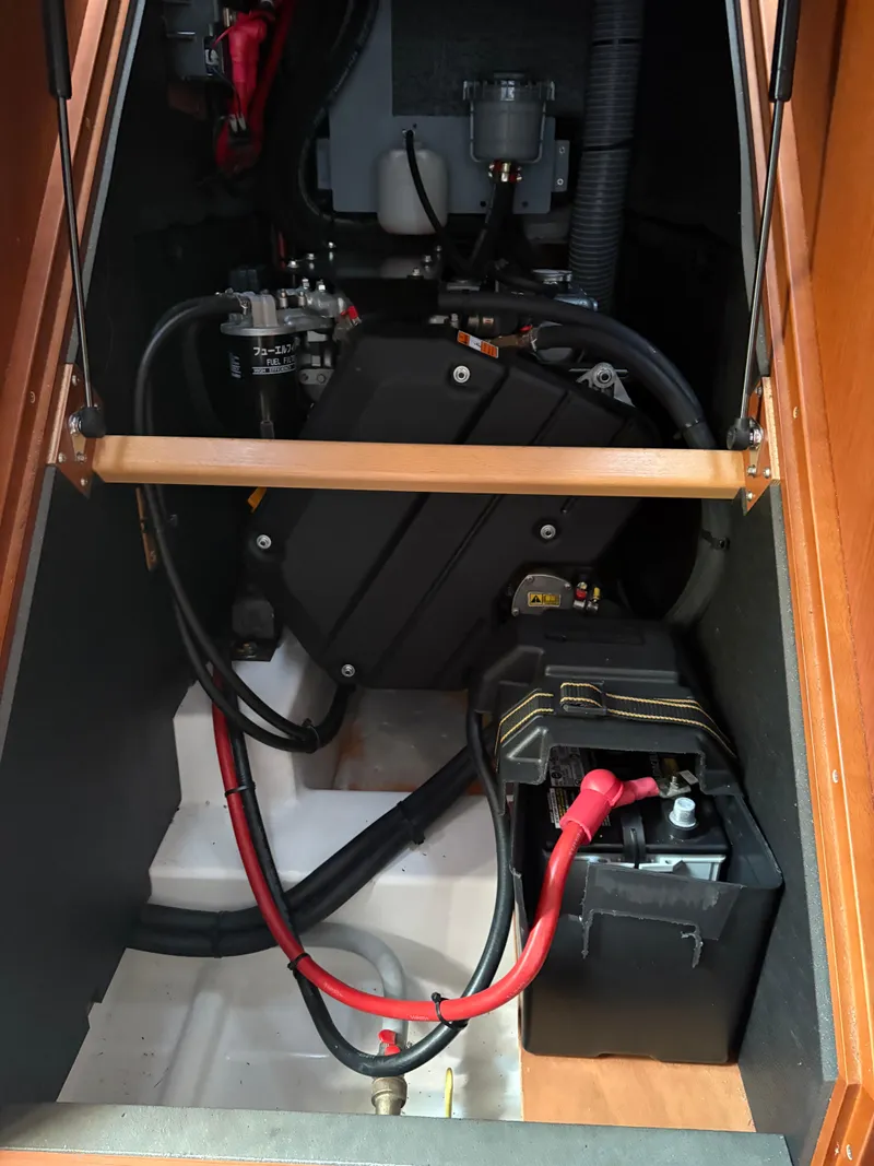 Slide: The Image of Engine compartment of a 2018 Beneteau Oceanis 45 sailboat, showing battery and wiring. - 21