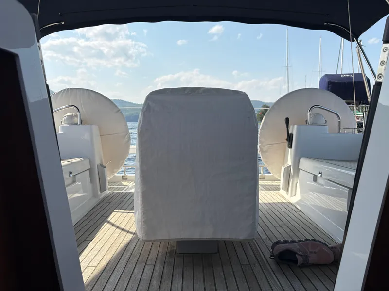 Slide: The Image of Cockpit view of 2018 Beneteau Oceanis 45 sailboat with covered helm and seating. - 23